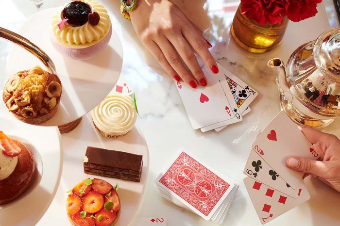 La Galerie Tea Time with a selection of Angelo Musa’s signature pastries set on a marble table, at Hotel Plaza Athénée, Paris